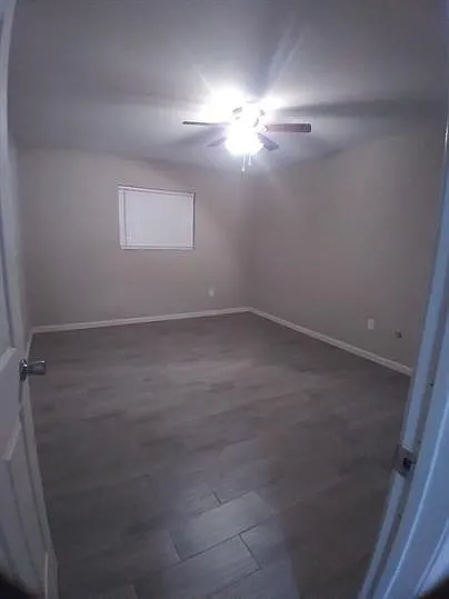 2nd bedroom with tile flooring and 2 closets