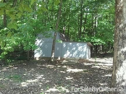storage building on slab with exterior light pole