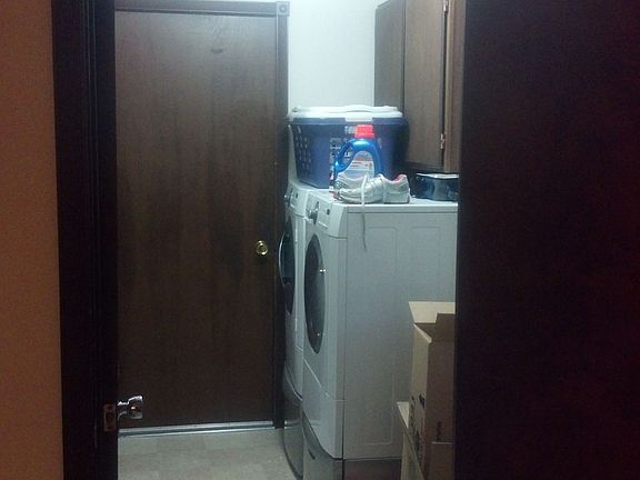 Laundry Room.  Door to two-car garage, 1/2 bathroom is on left