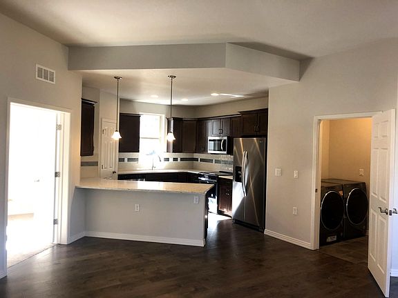 4th image of 9411 E 58th Ave