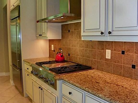 Large kitchen with gorgeous Benedettini inked cabinets.