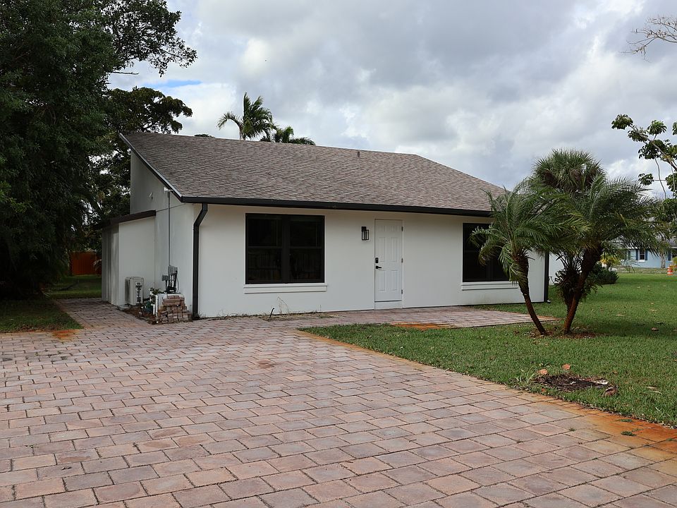 front entrance and driveway separate road coming in