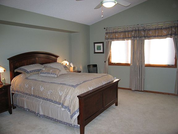 Spacious owner's suite with vaulted ceiling, private bath and walk-in closet