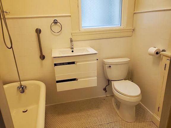 Bathroom with Claw Foot tub/Shower combo. Landlord will provide new clear shower curtains.
