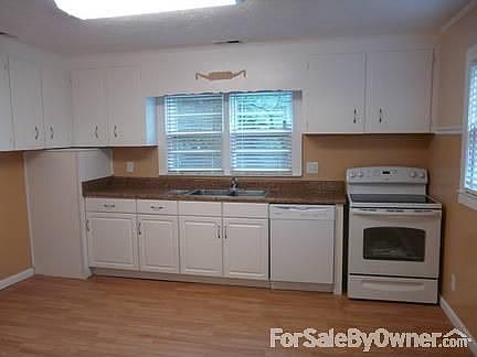 BRIGHT KITCHEN
						:
						Eat-in sz kitchen with new cabinets, countertops, flooring & appliances