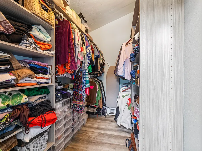 Primary bedroom walk-in closet