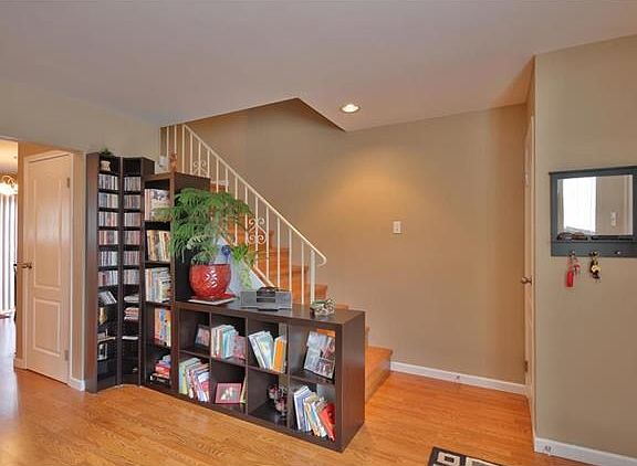 Living Room  with laminate staircase to the 2nd level.