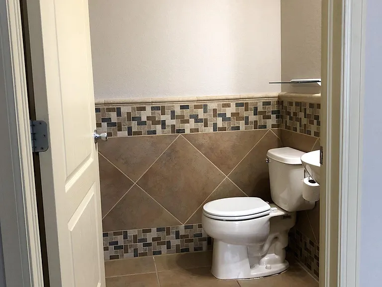 Powder room has an additional linen closet. You can never have too much storage!