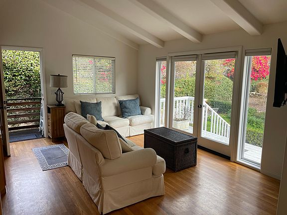 Family room and french doors leading to the deck and or the patioi/BBQ area.
