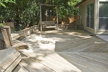 The deck of this home is extensive with built-in seating
