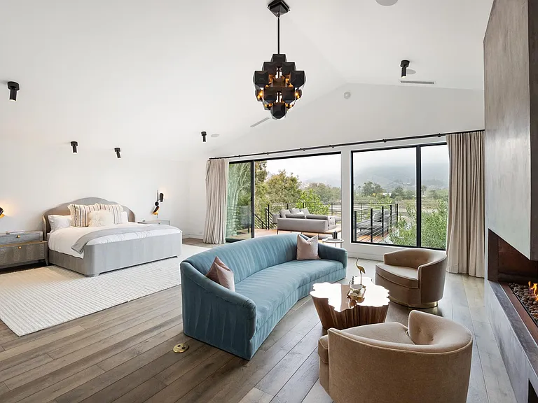 The spacious primary suite features a large walk-in closet and incredible views.