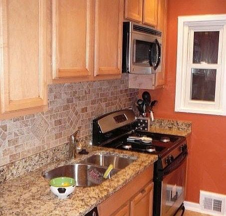 Kitchen with granite counter tops and stainless steel appliances