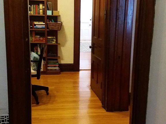 View from front hall through bonus room to back door
