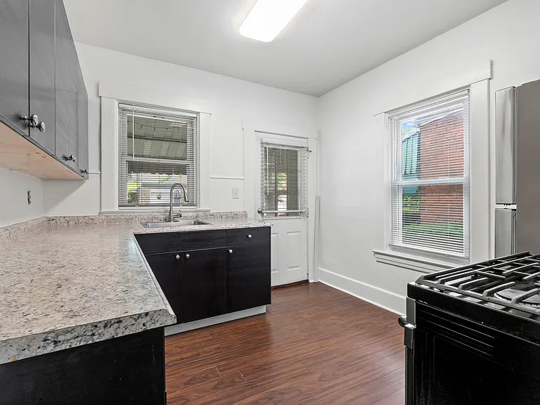 Updated Kitchen with stainless steel appliances, gas stove and refrigerator.