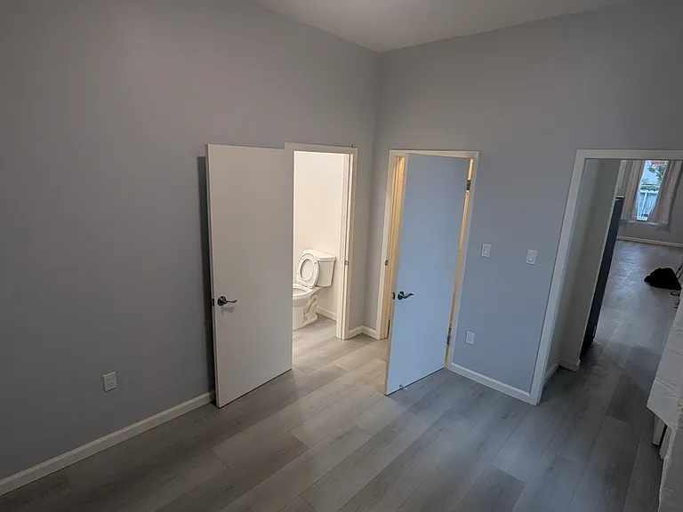 Office area, bathroom and closet. Looking into living room.