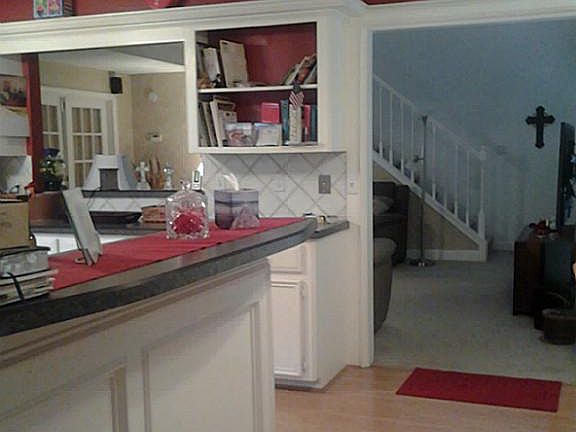 Open kitchen to den and breakfast area