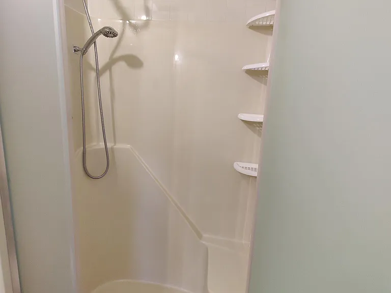 Master Shower with brand new fixtures and glass door.