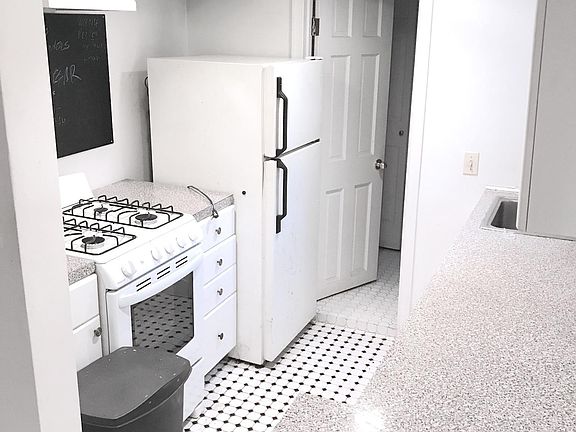 Galley kitchen with new gas stove