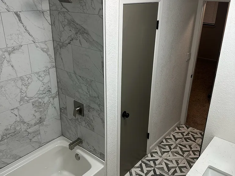 Bathroom- shower/tub, vanity with storage, Custom floor and shower tile.