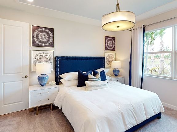 This comfortable owner s suite boasts two walk-in closets, as well as a private bathroom that featur