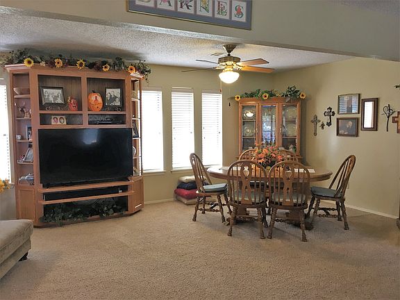 Den, dining and living area 