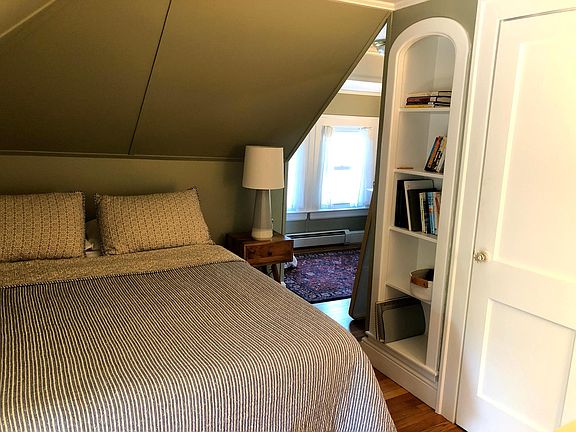 Bedroom with built in bookshelf, two closet