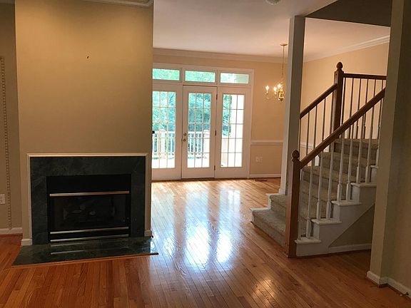 View from Living Room to dining room and steps leading to bedrooms
