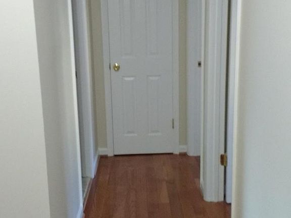 Hallway to 2nd bath and 2nd and 3rd bedrooms