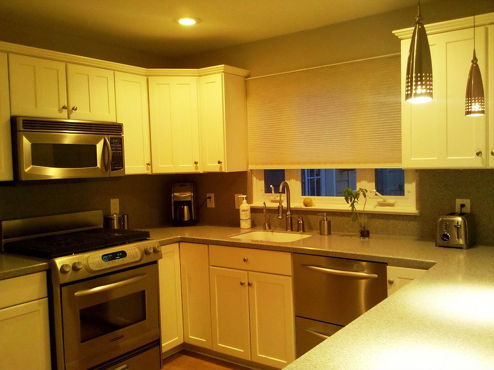 Updated Kitchen. Corian Countertops and Backsplash. SS Kitchen Aid appliances.