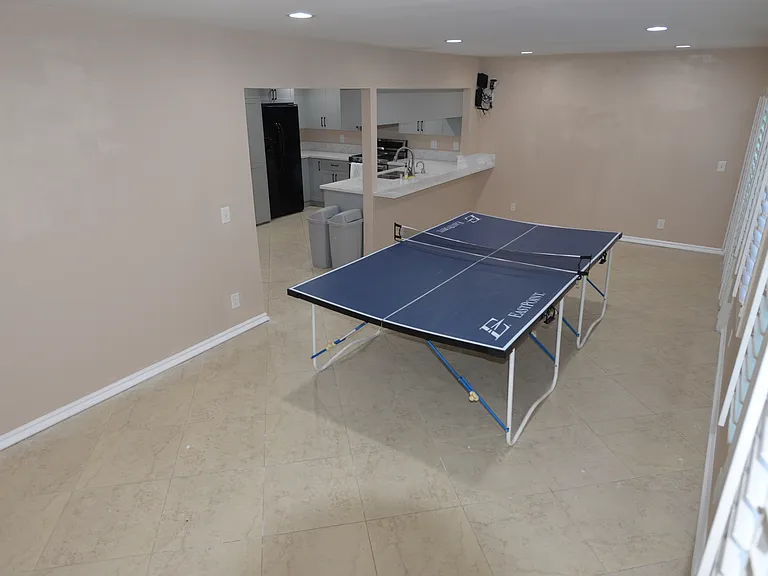 We filled this room with workout equipment when we lived here, with a nice pool view. The previous owner used this room as a second living room with couches, tv and desk.