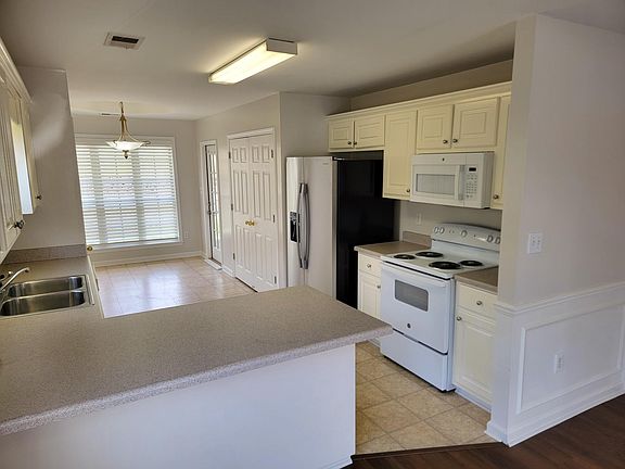 Eat at bar views kitchen & breakfast nook.