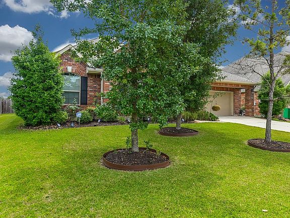 Curb appeal galore! Immaculate landscaping and mature trees give this charming home a welcoming feel from the moment you pull up.