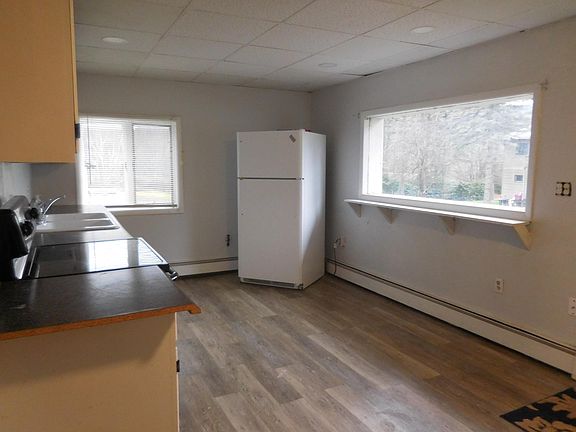 Kitchen with stove and refrigerator