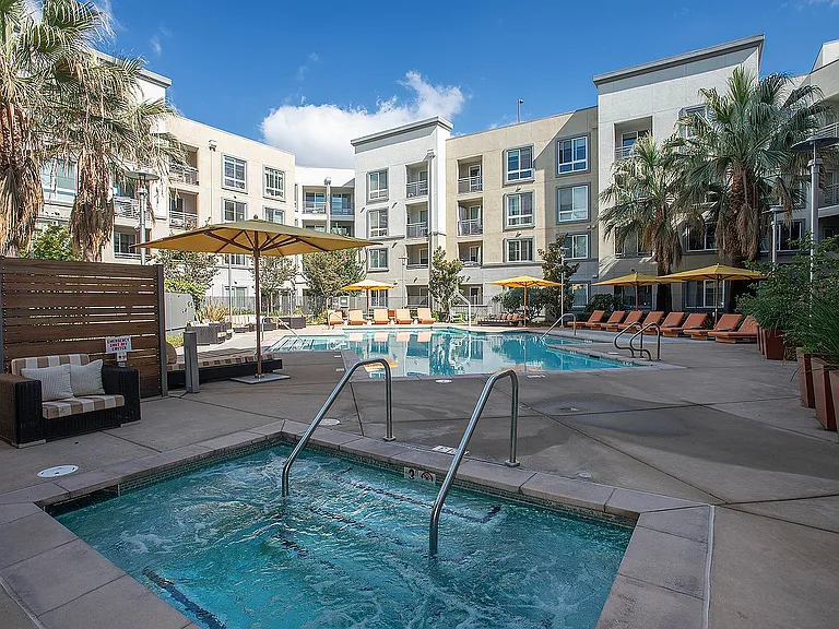 Pool courtyard with lounge areas and modern design at Aster Apartments in Dublin, CA.