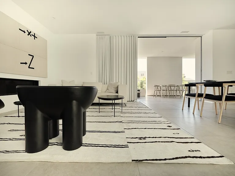 Minimalist Corridor with Thoughtful Architectural Detailing _ This two-bedroom passageway is designed to enhance spatial flow, featuring floor-to-ceiling frosted glass panels for soft natural light and a seamless transition into the main living areas.