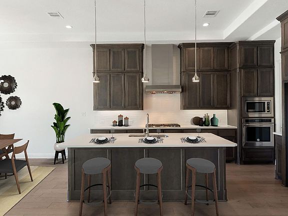 Kitchen features breakfast bar, virtually staged for demonstration