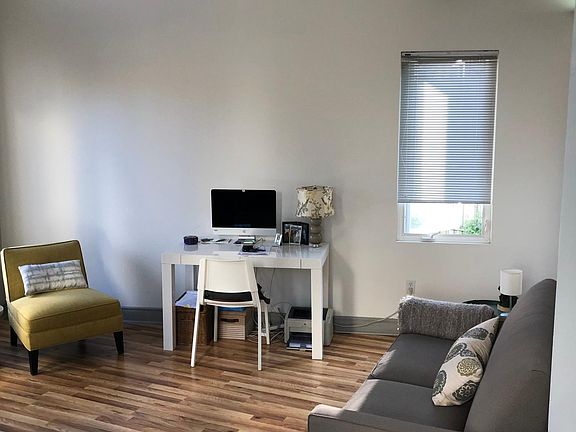 First floor landing room. Open with vaulted ceiling for many flexible uses.