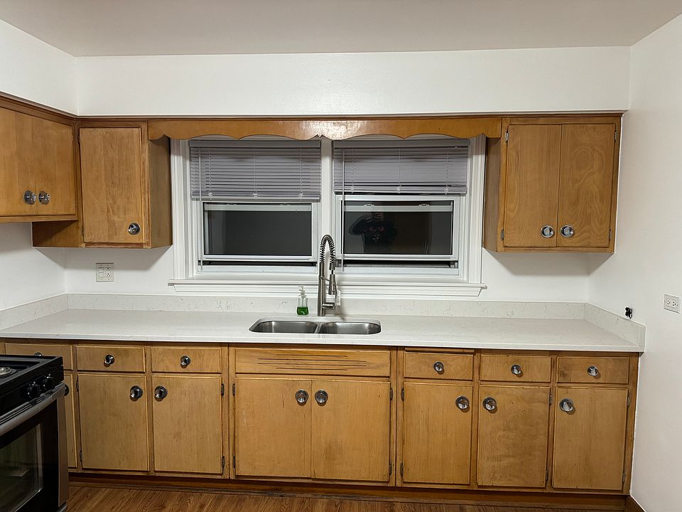 Kitchen with quartz countertop and double sink