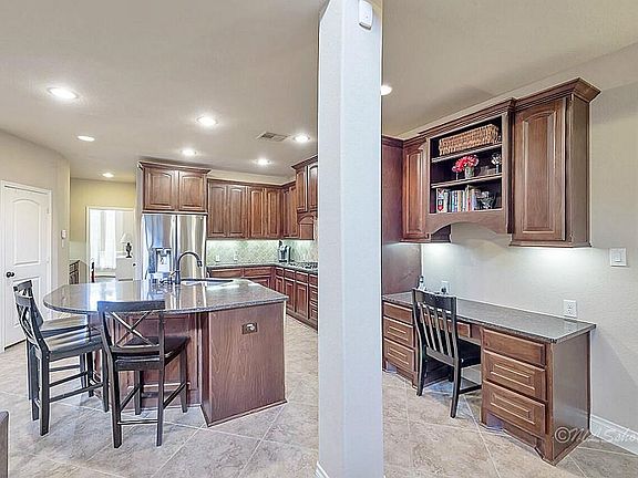 Loads of gleaming cabinets! The built in desk will come in handy.