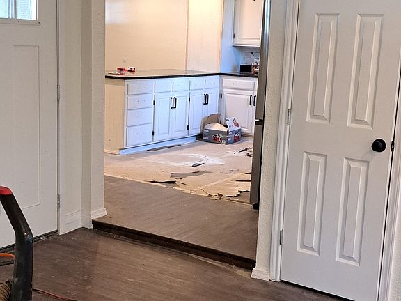 Entry off of carport & Family Room looking into kitchen