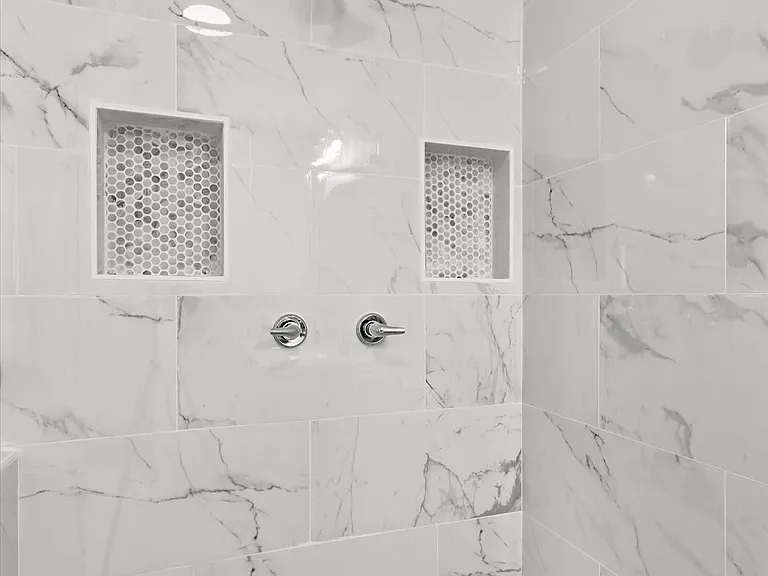 Full bathroom with a tile shower