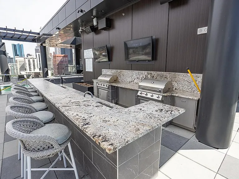 Rooftop bar and grill available to residents.