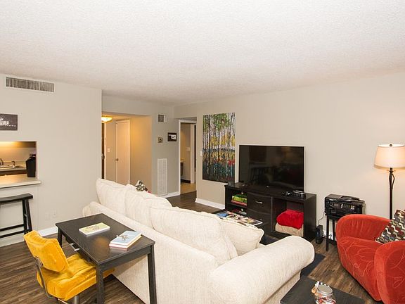 The open living room/kitchen includes a small dining nook, o