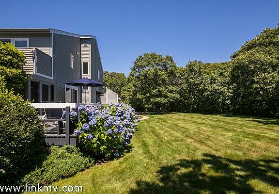 View of deck and spacious yard
