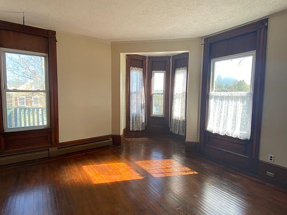 Bedroom number two, 15x15, hardwood floor and non working fireplace