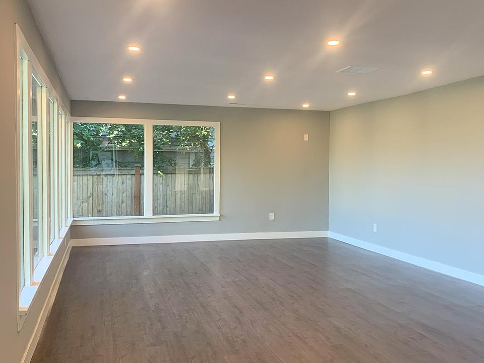 Huge, well lit east facing living room with plenty of large windows