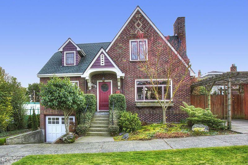 Truly one of a kind English Tudor in Ballard's Whittier Heights neighborhood. Restored old world charm with tasteful updates throughout. Ample sized rooms in this 2,980 sf home boasting an extremely private, 6,300 sf lot with gorgeous landscaping that you must see to believe. Fully remodeled lower level, updated plumbing & electric, on demand hot water system and large patio & deck are just a few of this home's many features. Batchelder fireplace & hardwood floors beneath the custom wool carpet.