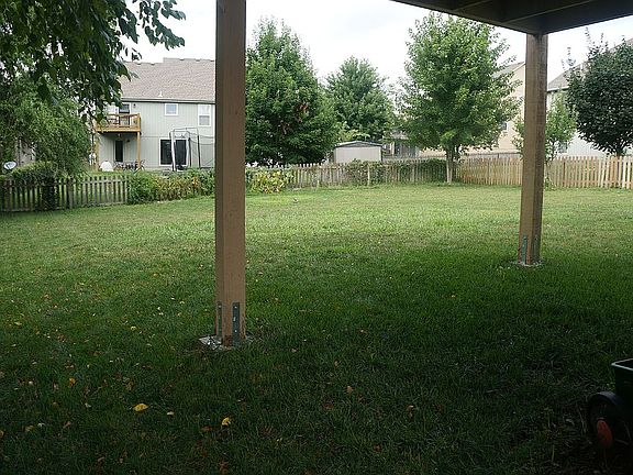 Fenced back yard with garden