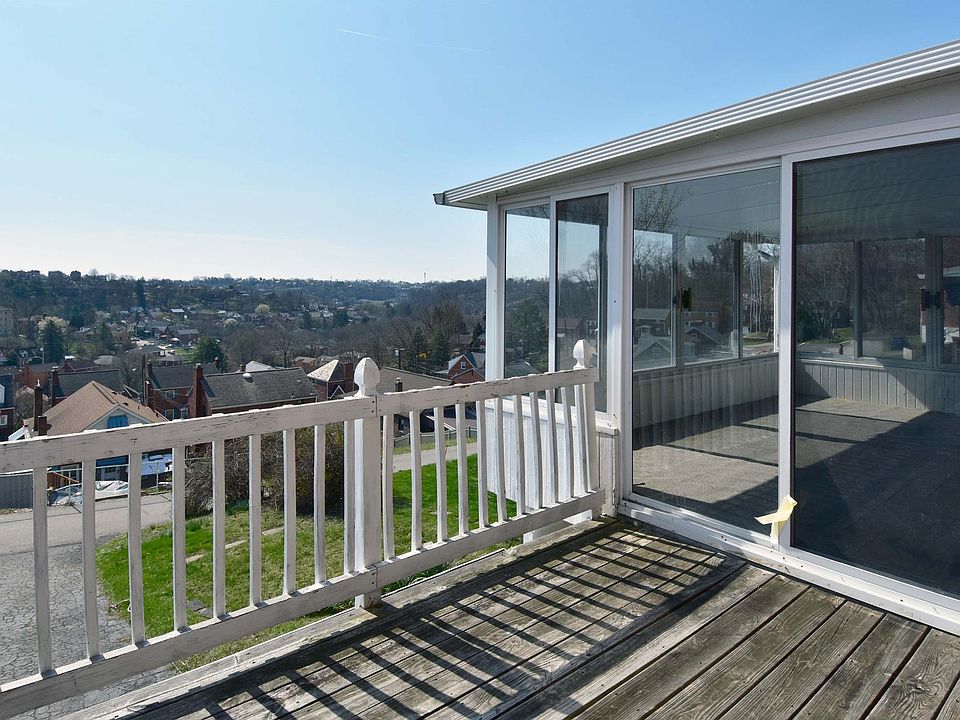 Enjoy stunning views of Brentwood from your sunroom and open deck.