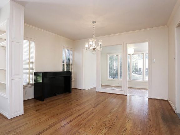 View of dining room and den beyond.